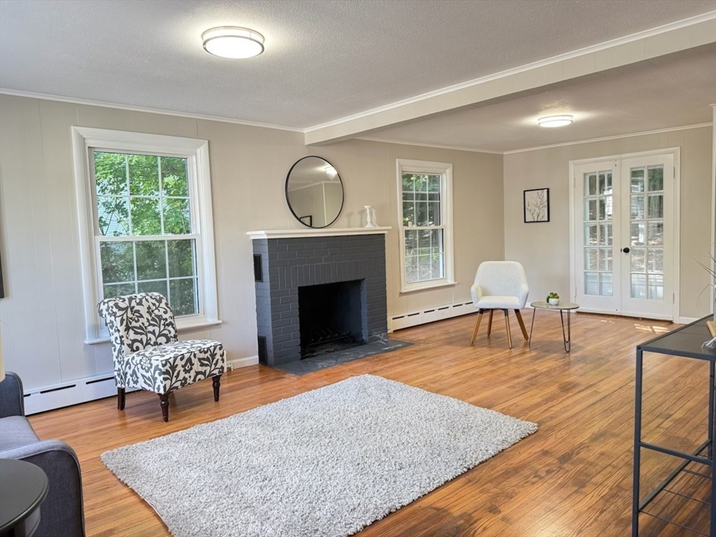 37 Bridge Street Monson, MA 01057 - Photo 5 of 35 a living room with furniture and a fireplace