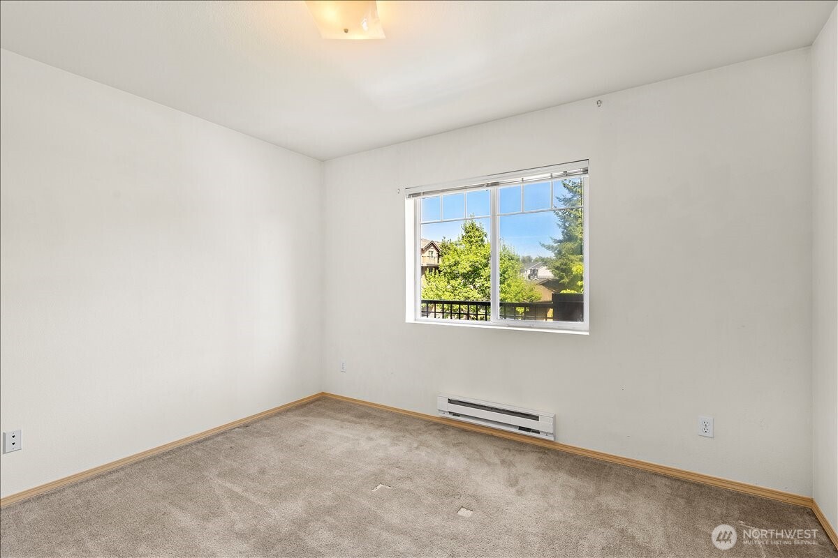18930 Bothell Everett Highway, Unit B303 Bothell, WA 98012 - Photo 14 of 20 an empty room with windows