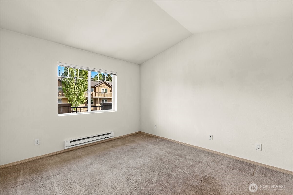 18930 Bothell Everett Highway, Unit B303 Bothell, WA 98012 - Photo 16 of 20 an empty room with windows
