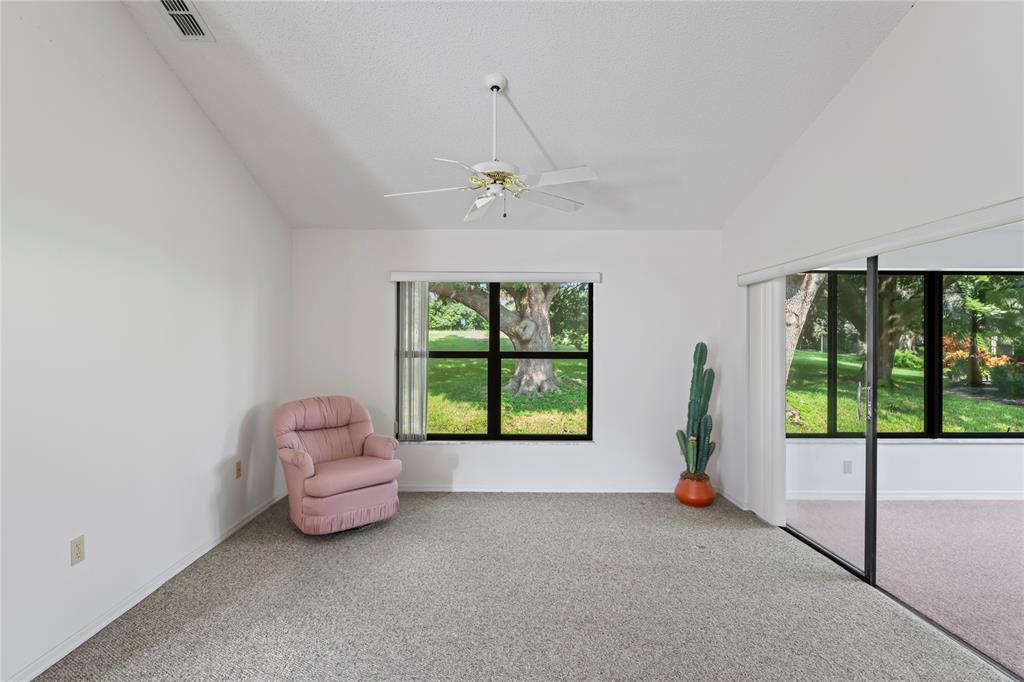 9108 Bassett Lane, Unit B New Port Richey, FL 34655 - Photo 16 of 66 a view of an empty room with a window
