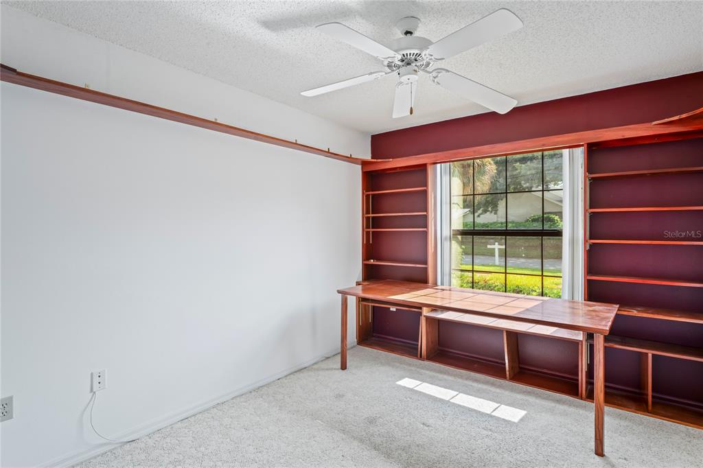 9108 Bassett Lane, Unit B New Port Richey, FL 34655 - Photo 29 of 66 a room with furniture and window