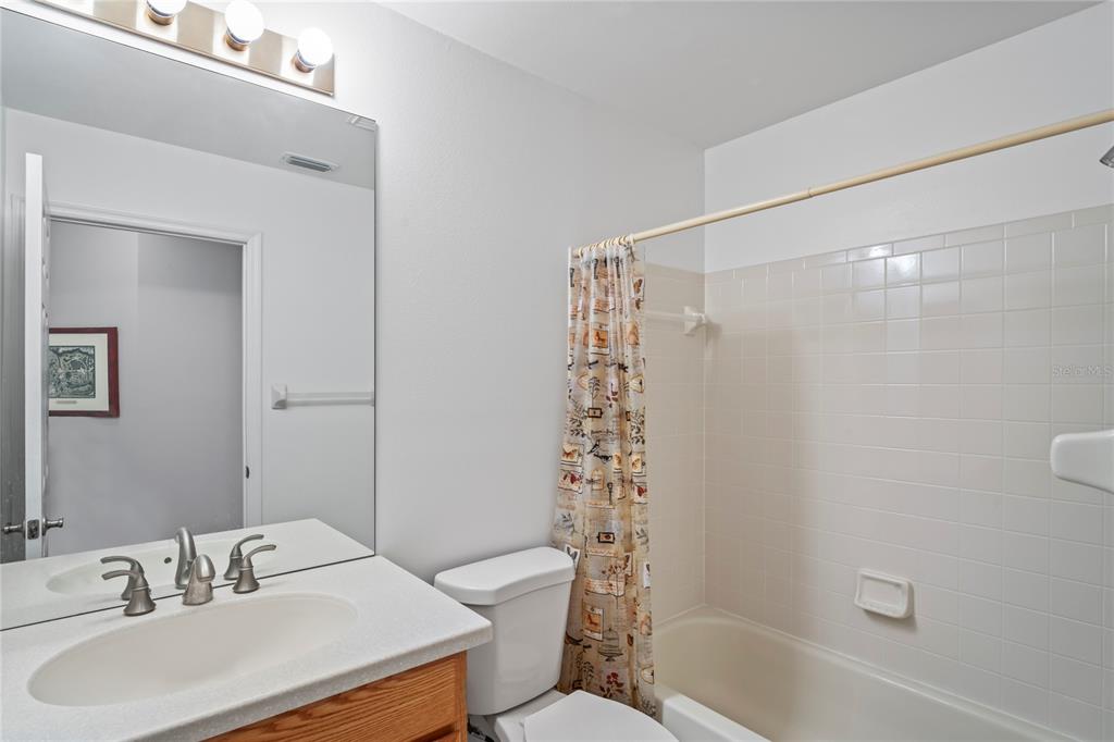 9108 Bassett Lane, Unit B New Port Richey, FL 34655 - Photo 32 of 66 a bathroom with a sink toilet and shower