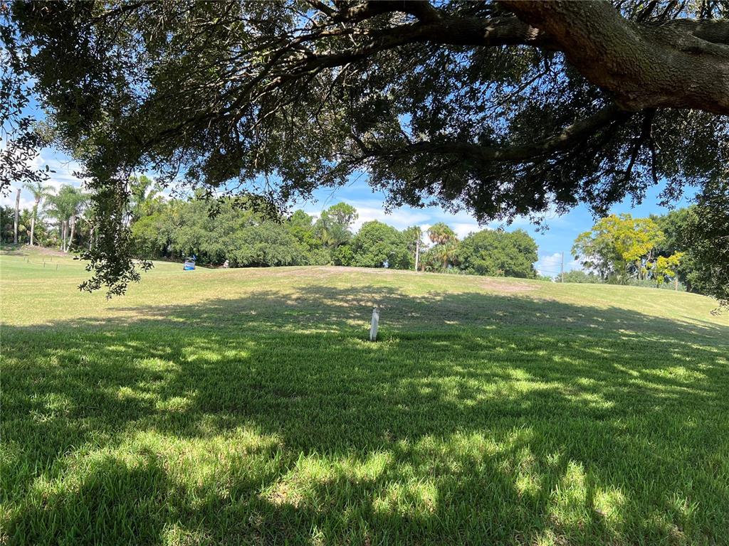 9108 Bassett Lane, Unit B New Port Richey, FL 34655 - Photo 39 of 66 a view of outdoor space with deck and yard