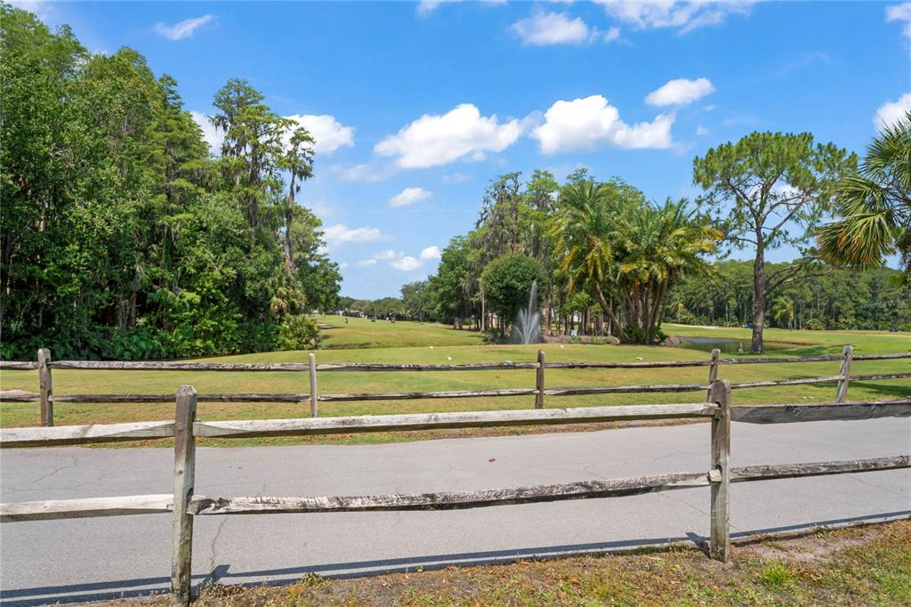 9108 Bassett Lane, Unit B New Port Richey, FL 34655 - Photo 47 of 66 a view of a garden with an outdoor space