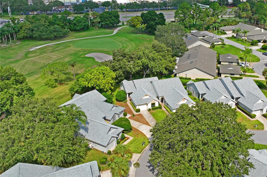 9108 Bassett Lane, Unit B New Port Richey, FL 34655 - Photo 56 of 66 an aerial view of residential houses with outdoor space and street view