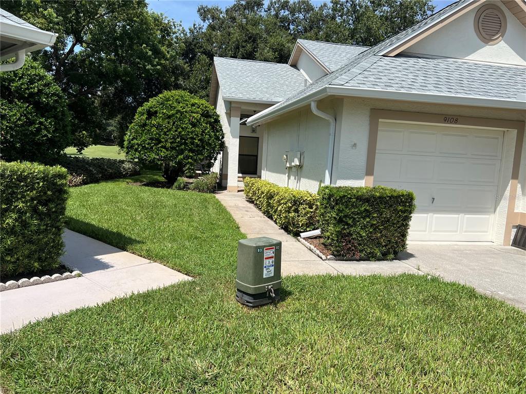 9108 Bassett Lane, Unit B New Port Richey, FL 34655 - Photo 66 of 66 a view of a back yard of the house
