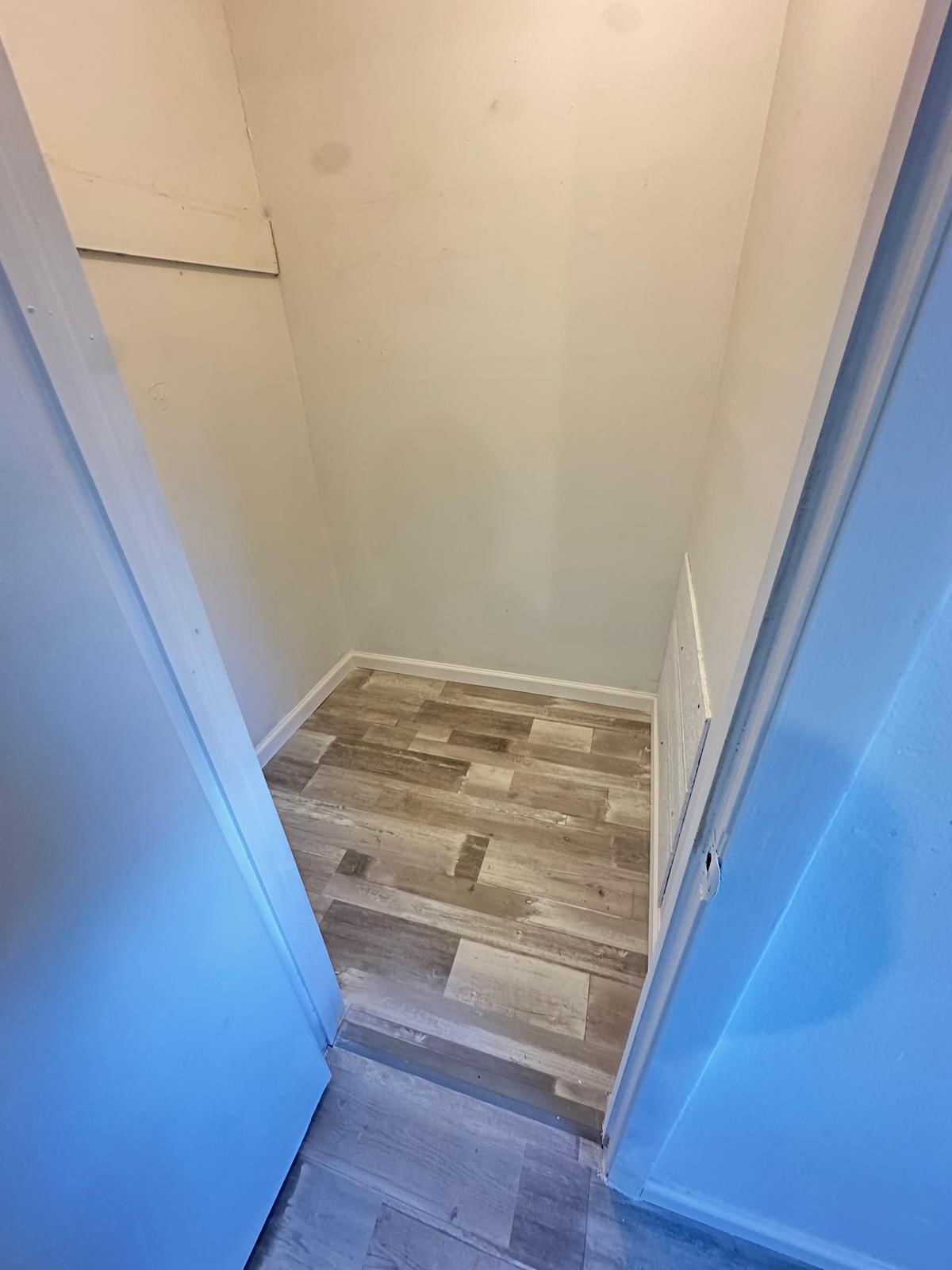 600 West Mimosa Street Angleton, TX 77515 - Photo 13 of 18 a view of staircase with white walls and white door