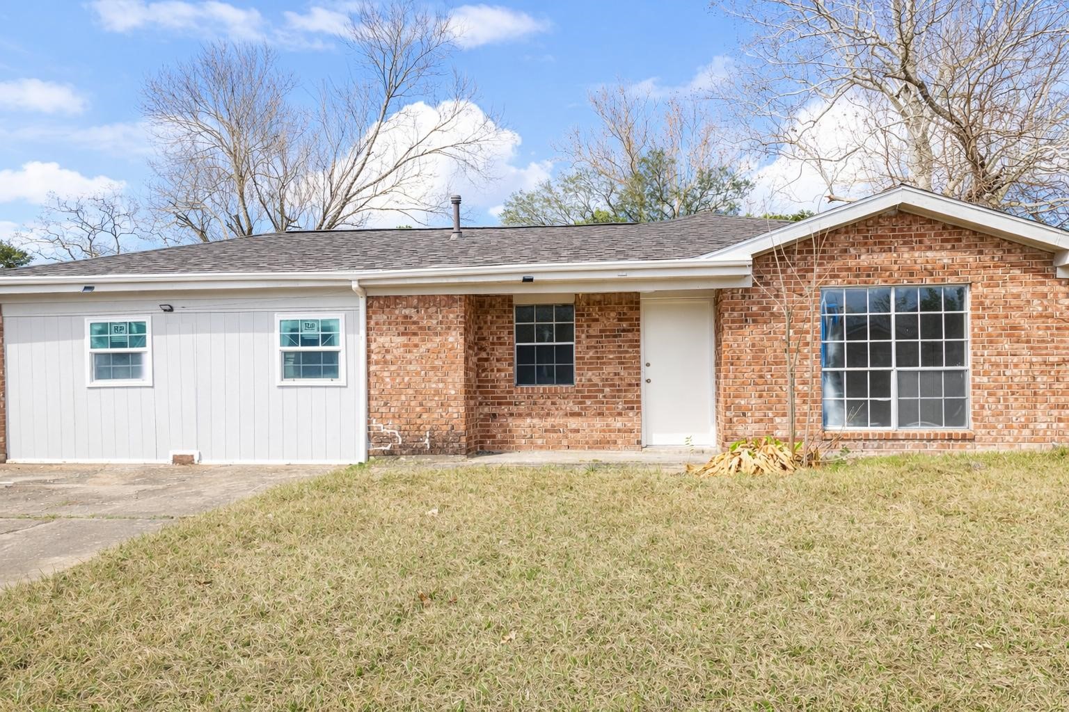 600 West Mimosa Street Angleton, TX 77515 - Photo 2 of 18 a front view of a house with a yard