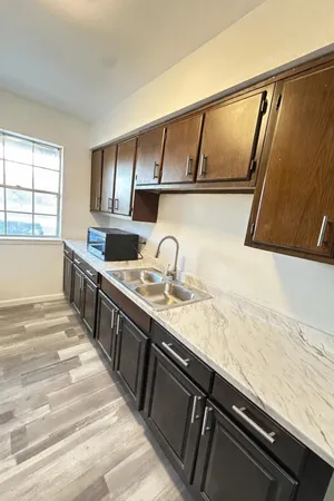 a kitchen with a stove and a refrigerator