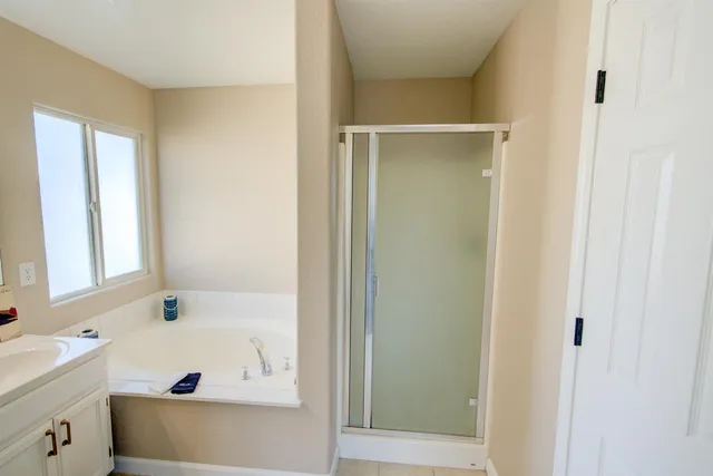 a bathroom with a bathtub and a sink