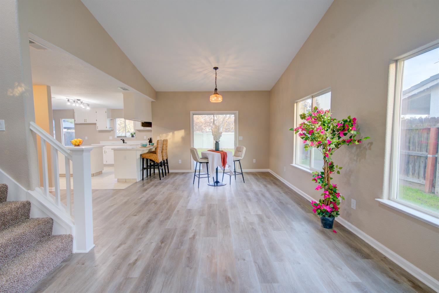 3546 Paseo Verde Avenue Merced, CA 95348 - Photo 4 of 24 a living room with furniture wooden floor and a chandelier