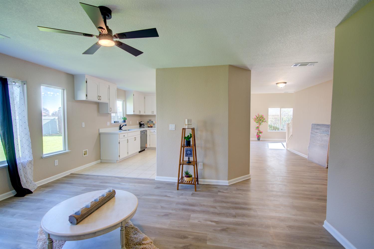 3546 Paseo Verde Avenue Merced, CA 95348 - Photo 10 of 24 a view of a livingroom with furniture wooden floor and window
