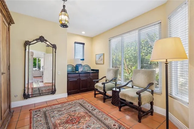 a view of a patio with table and chairs potted plants with wooden fence
