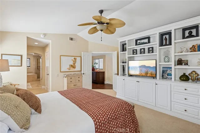 a bathroom with a granite countertop sink mirror and a bath tub