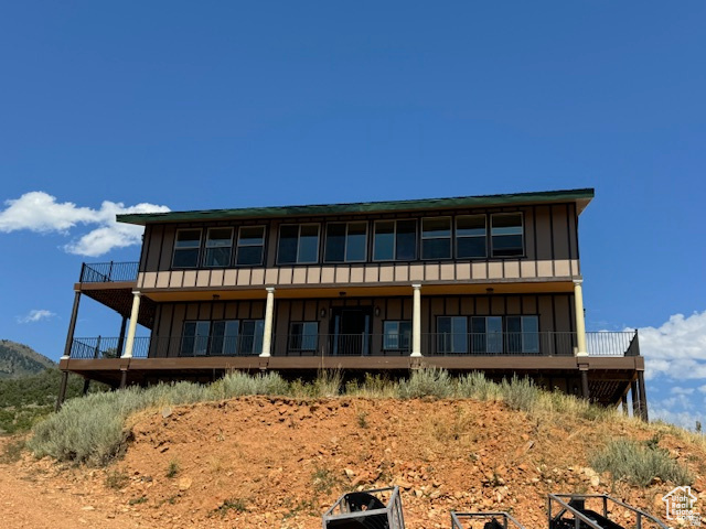 6909 East Spring Drive, Unit 19 Springville, UT 84663 - Photo 2 of 118 Two-story residence featuring extensive decking, numerous windows, and multiple sliding glass doors