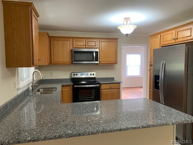 18270 Douglas Drive Capron, VA 23829 - Photo 19 of 28 a kitchen with stainless steel appliances granite countertop a refrigerator a stove top oven and a sink with wooden floor