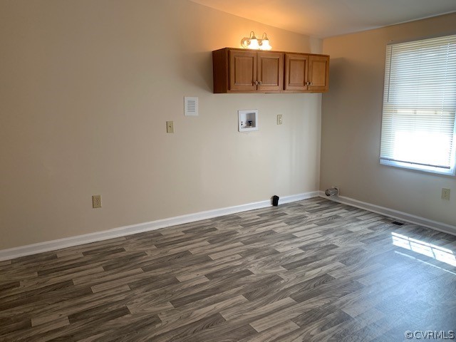 18270 Douglas Drive Capron, VA 23829 - Photo 21 of 28 a view of a kitchen with wooden floor and cabinets