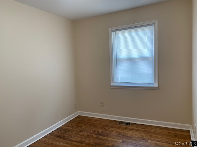 18270 Douglas Drive Capron, VA 23829 - Photo 8 of 28 a view of an empty room with wooden floor and a window