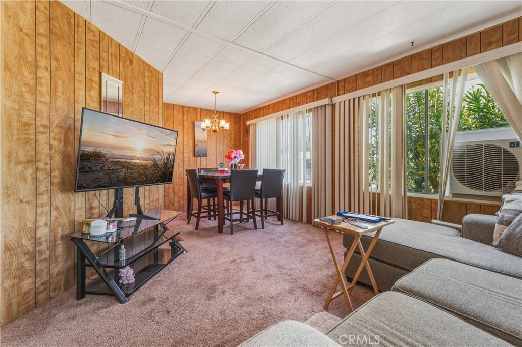 20683 Waalew Road, Unit B201 Apple Valley, CA 92307 - Photo 9 of 32 a living room with furniture and a flat screen tv