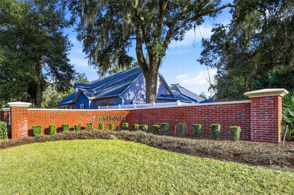 a view of a yard with wooden fence