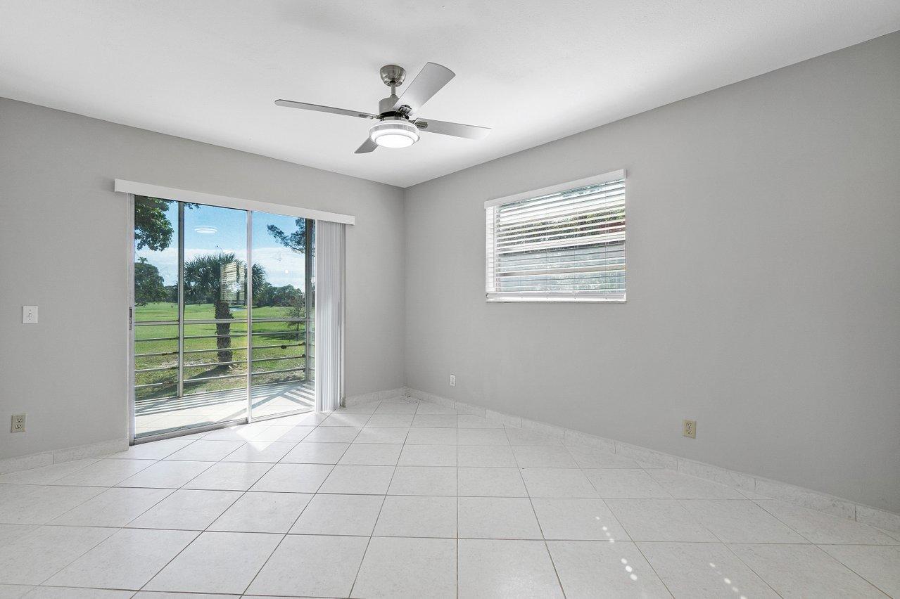 77 Normandy B Delray Beach, FL 33484 - Photo 14 of 34 a view of an empty room with a window