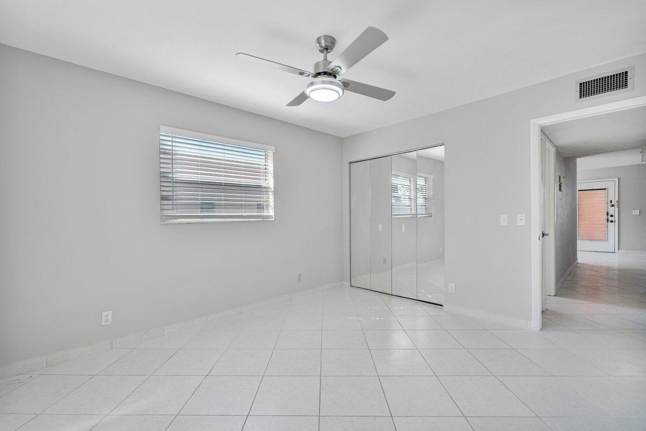 77 Normandy B Delray Beach, FL 33484 - Photo 15 of 34 a view of an empty room with a window