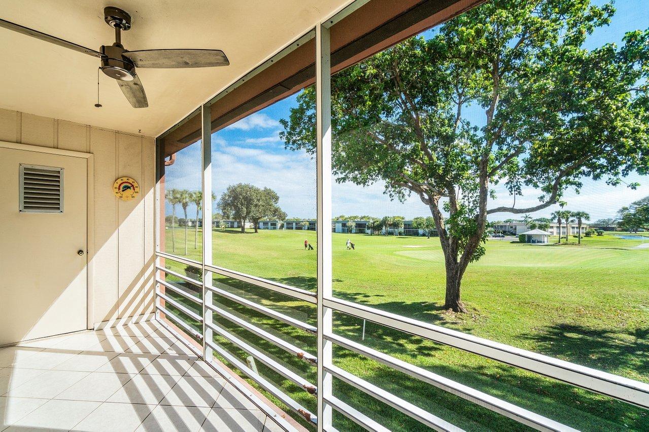 77 Normandy B Delray Beach, FL 33484 - Photo 3 of 34 a view of outdoor space with seating area