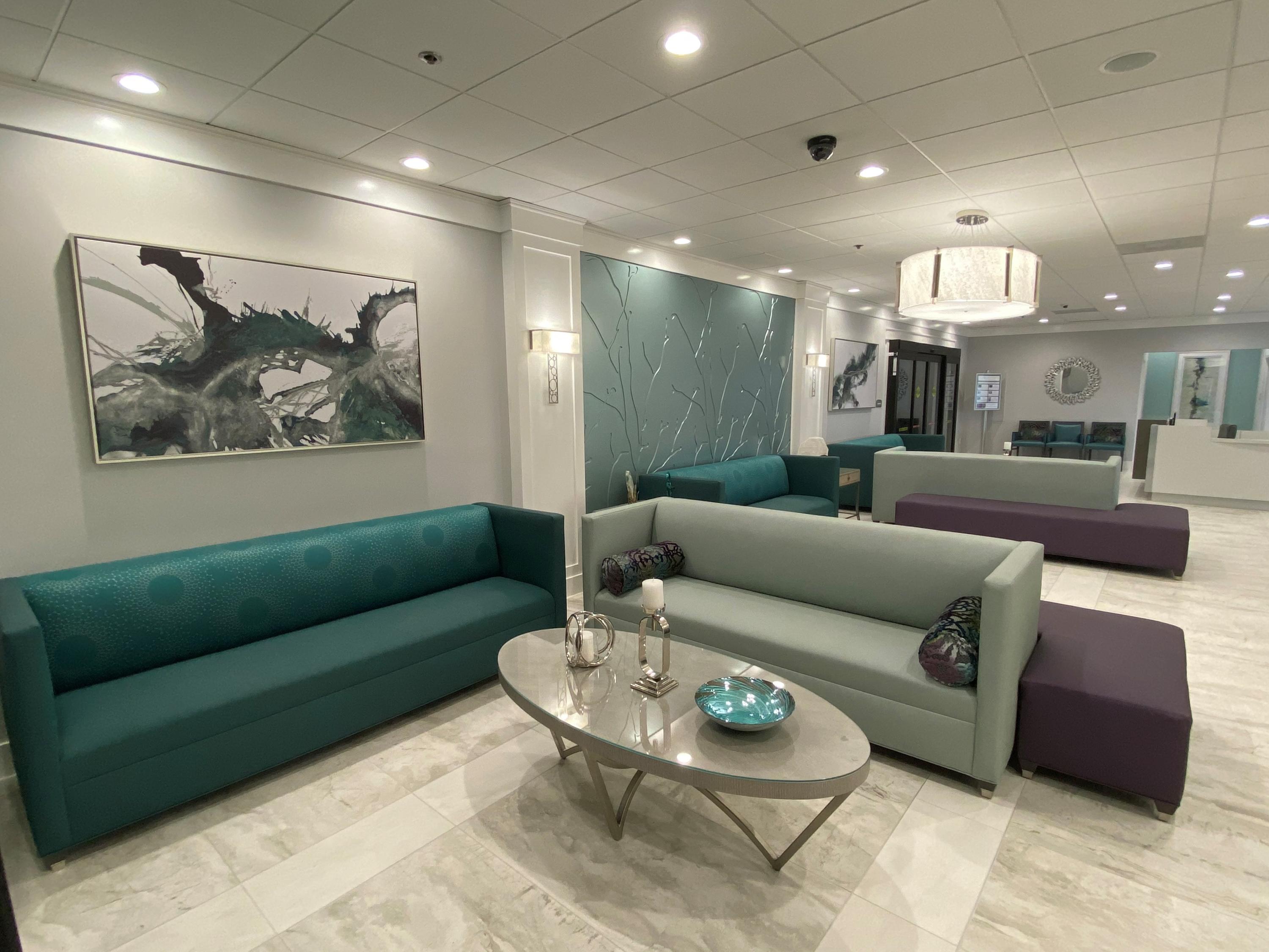 77 Normandy B Delray Beach, FL 33484 - Photo 27 of 34 a living room with furniture and a wooden floor