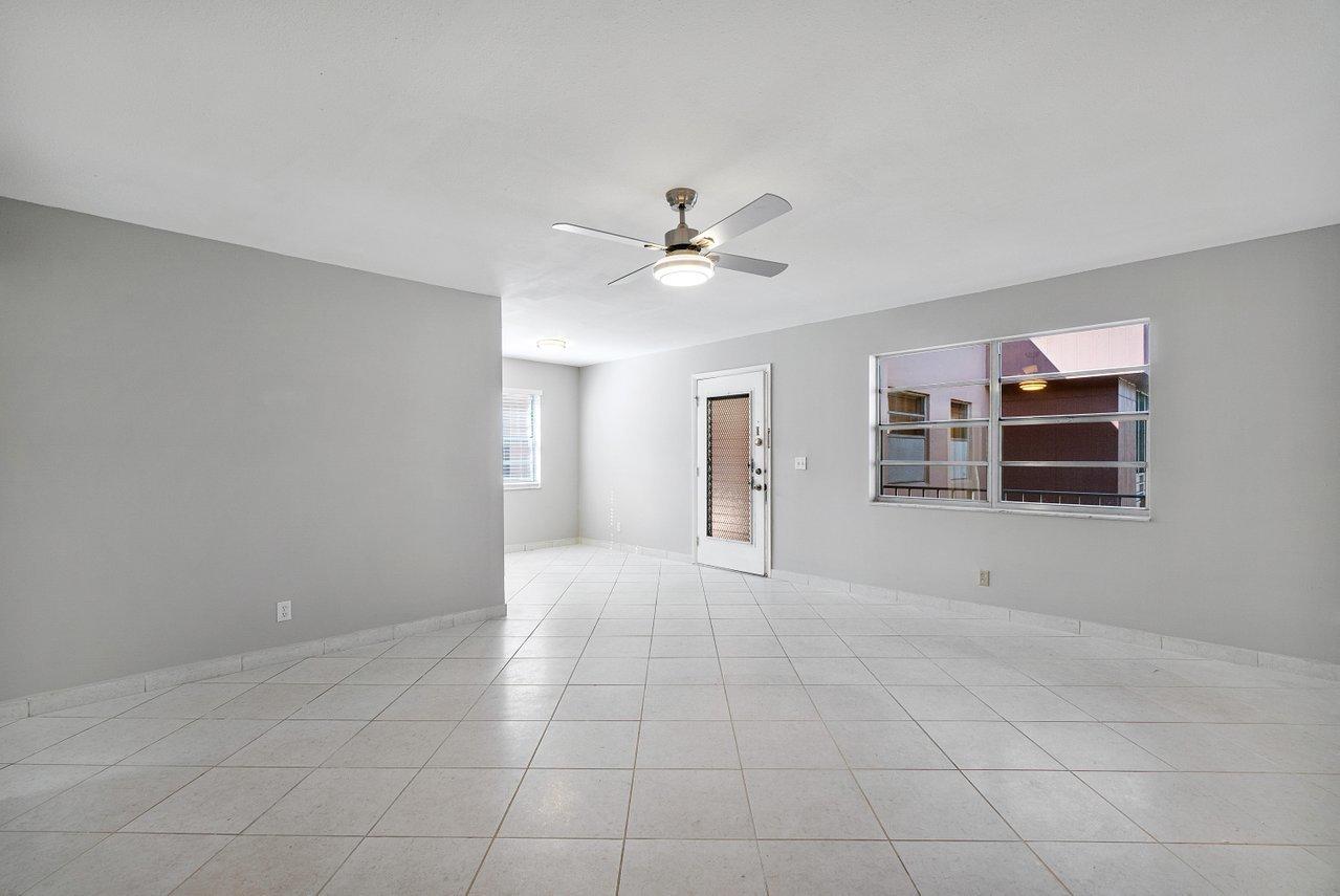 77 Normandy B Delray Beach, FL 33484 - Photo 6 of 34 a view of an empty room with a ceiling fan