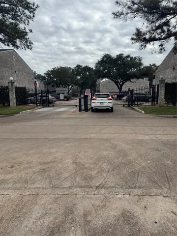 a view of street with parked cars