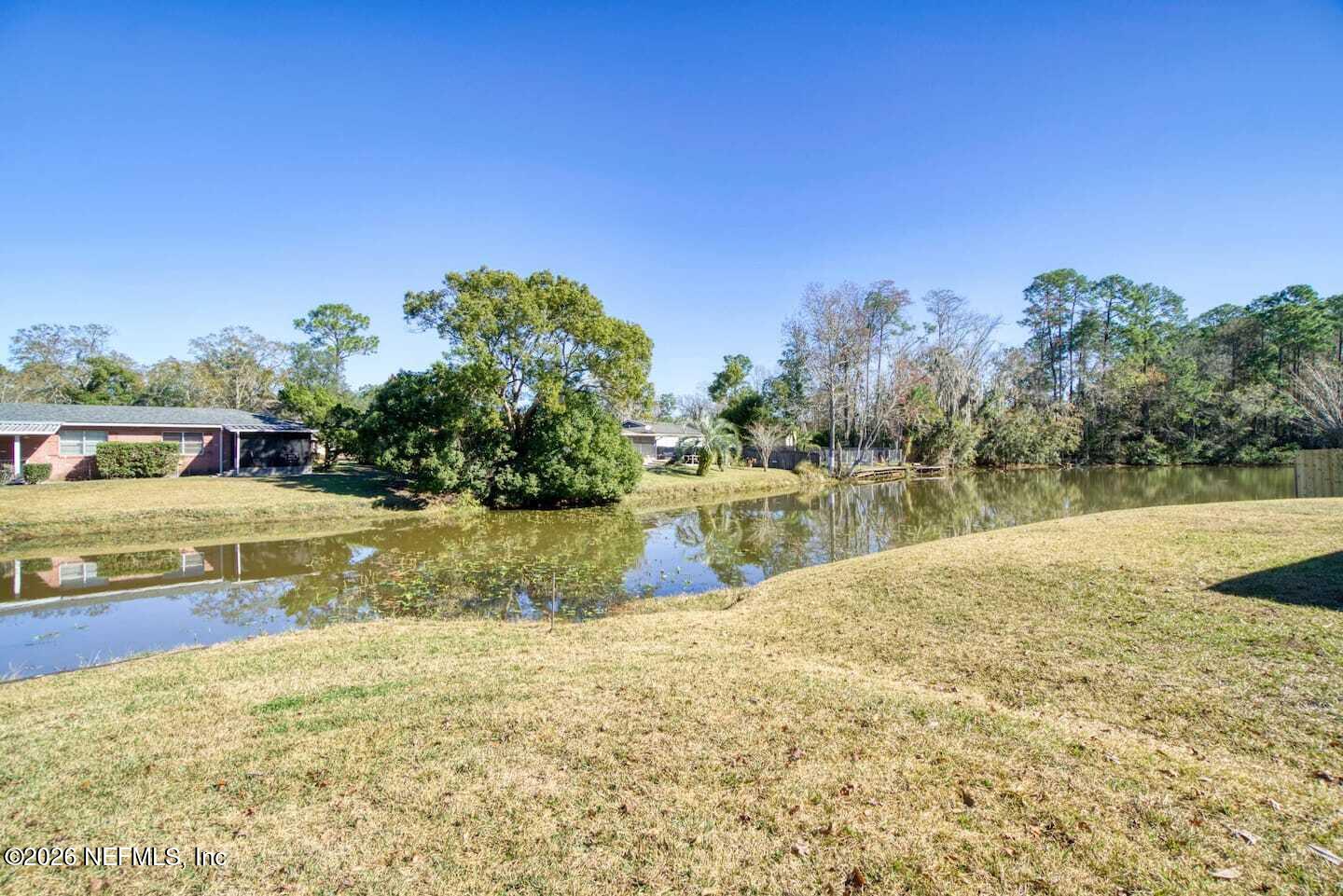 11613 Lake Ride Drive Jacksonville, FL 32223 - Photo 8 of 42 a view of swimming pool with a yard
