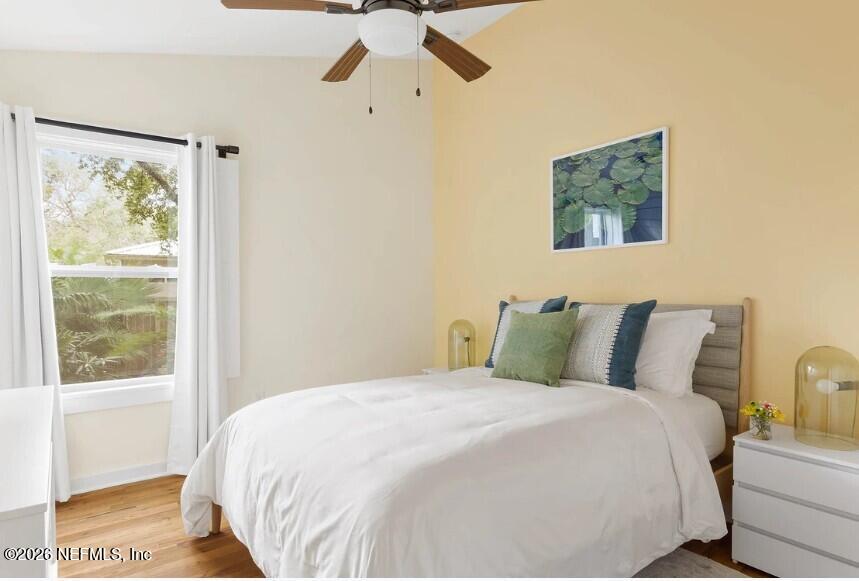 402 3rd Street St. Augustine, FL 32084 - Photo 11 of 29 a bedroom with a bed and a painting on the wall