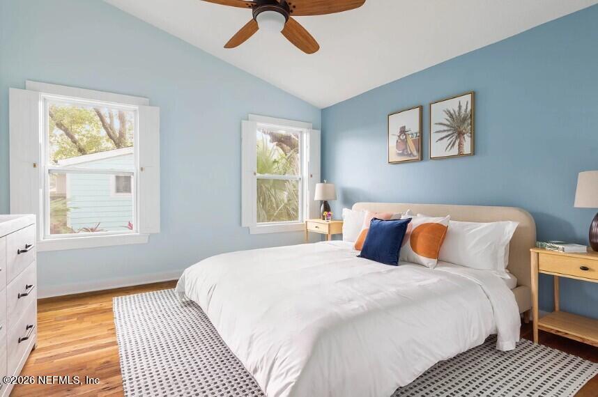 402 3rd Street St. Augustine, FL 32084 - Photo 14 of 29 a bedroom with a bed and wooden floor