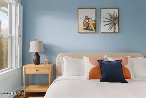 a living room with a couch and a window