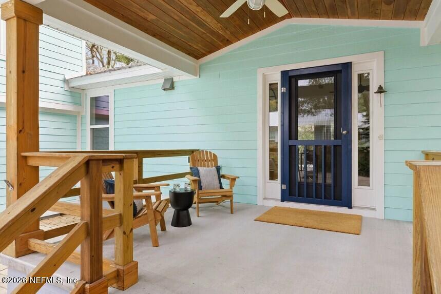 402 3rd Street St. Augustine, FL 32084 - Photo 18 of 29 a view of a patio with table and chairs and barbeque grill with a small yard