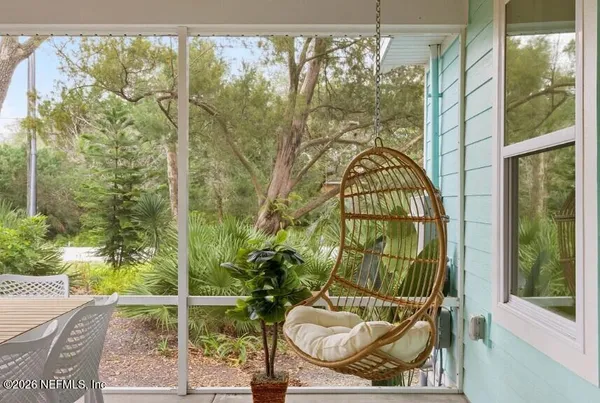 a view of a balcony door and furniture