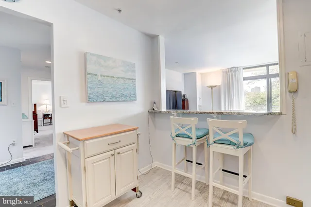a view of a kitchen with appliances and cabinets