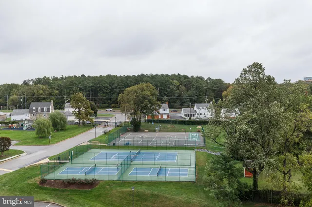 an aerial view of a house with a park