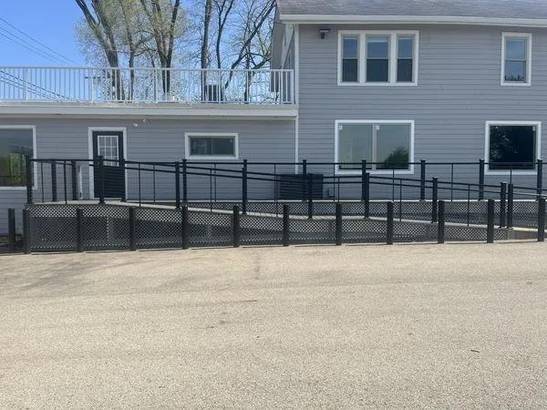 a view of a brick house with many windows