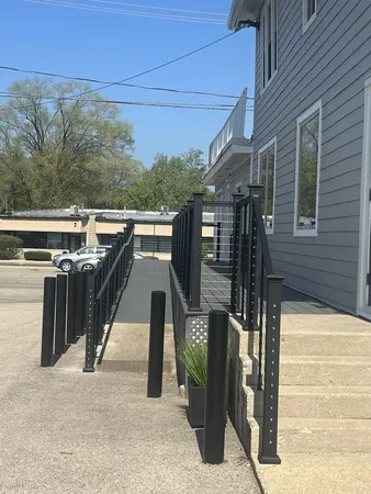 a view of a patio with table and chairs