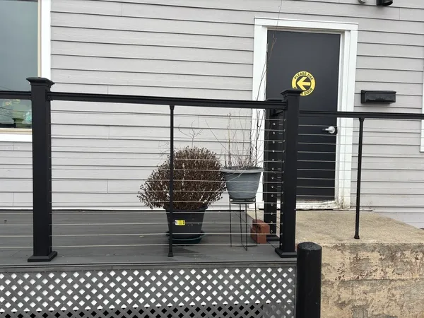 a view of outdoor space with cars parked