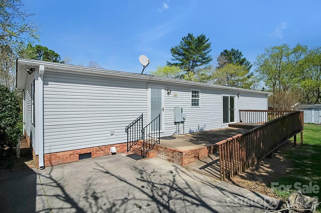 620 Anthony Grove Road Cherryville, NC 28021 - Photo 24 of 32 a view of a house with backyard and sitting area