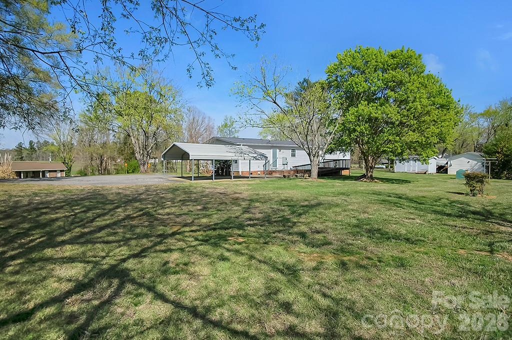 620 Anthony Grove Road Cherryville, NC 28021 - Photo 28 of 32 a view of a house with a yard