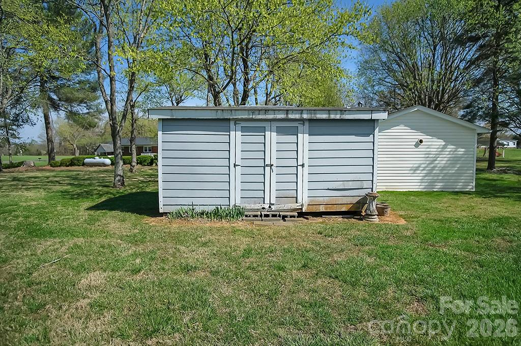 620 Anthony Grove Road Cherryville, NC 28021 - Photo 30 of 32 a view of a house with a yard