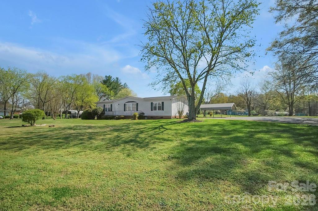 620 Anthony Grove Road Cherryville, NC 28021 - Photo 32 of 32 a front view of a house with a garden