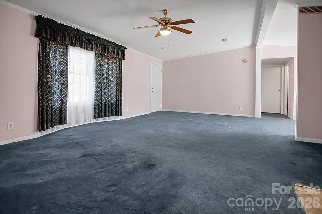 620 Anthony Grove Road Cherryville, NC 28021 - Photo 4 of 32 a view of a room with a ceiling fan and a window