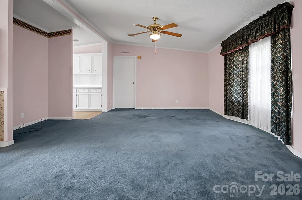 620 Anthony Grove Road Cherryville, NC 28021 - Photo 7 of 32 a view of a big room with closet and a ceiling fan