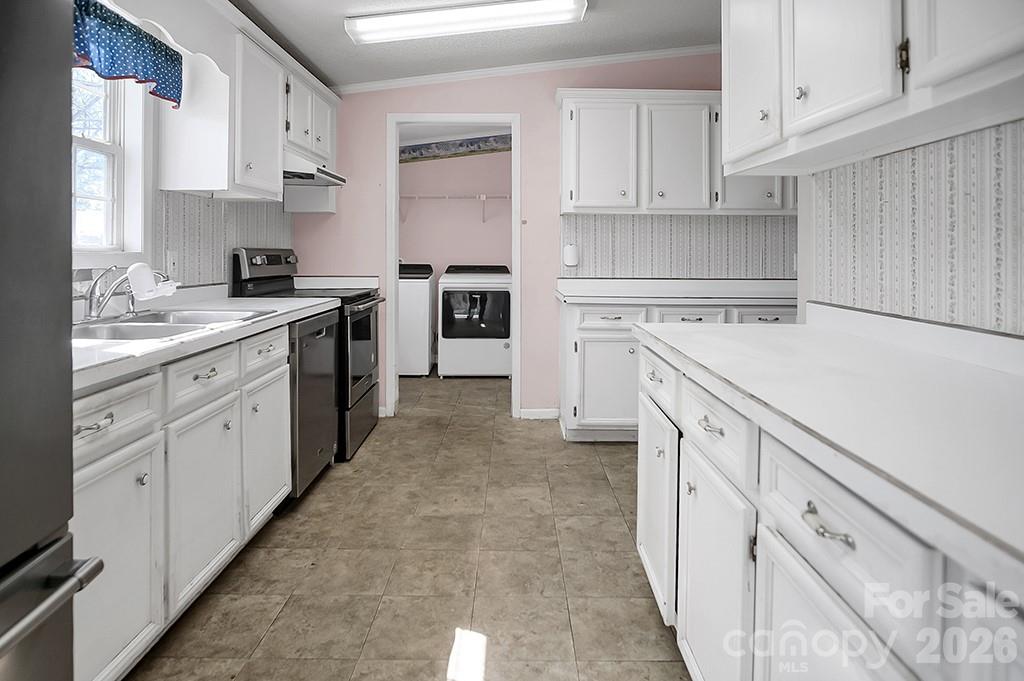 620 Anthony Grove Road Cherryville, NC 28021 - Photo 10 of 32 a kitchen with cabinets appliances a sink and a counter space