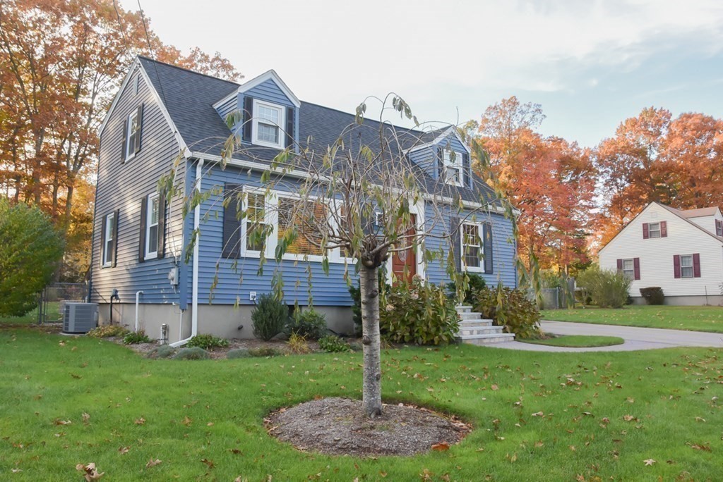 16 Walnut Road Chelmsford, MA 01824 - Photo 3 of 27 a front view of a house with a yard