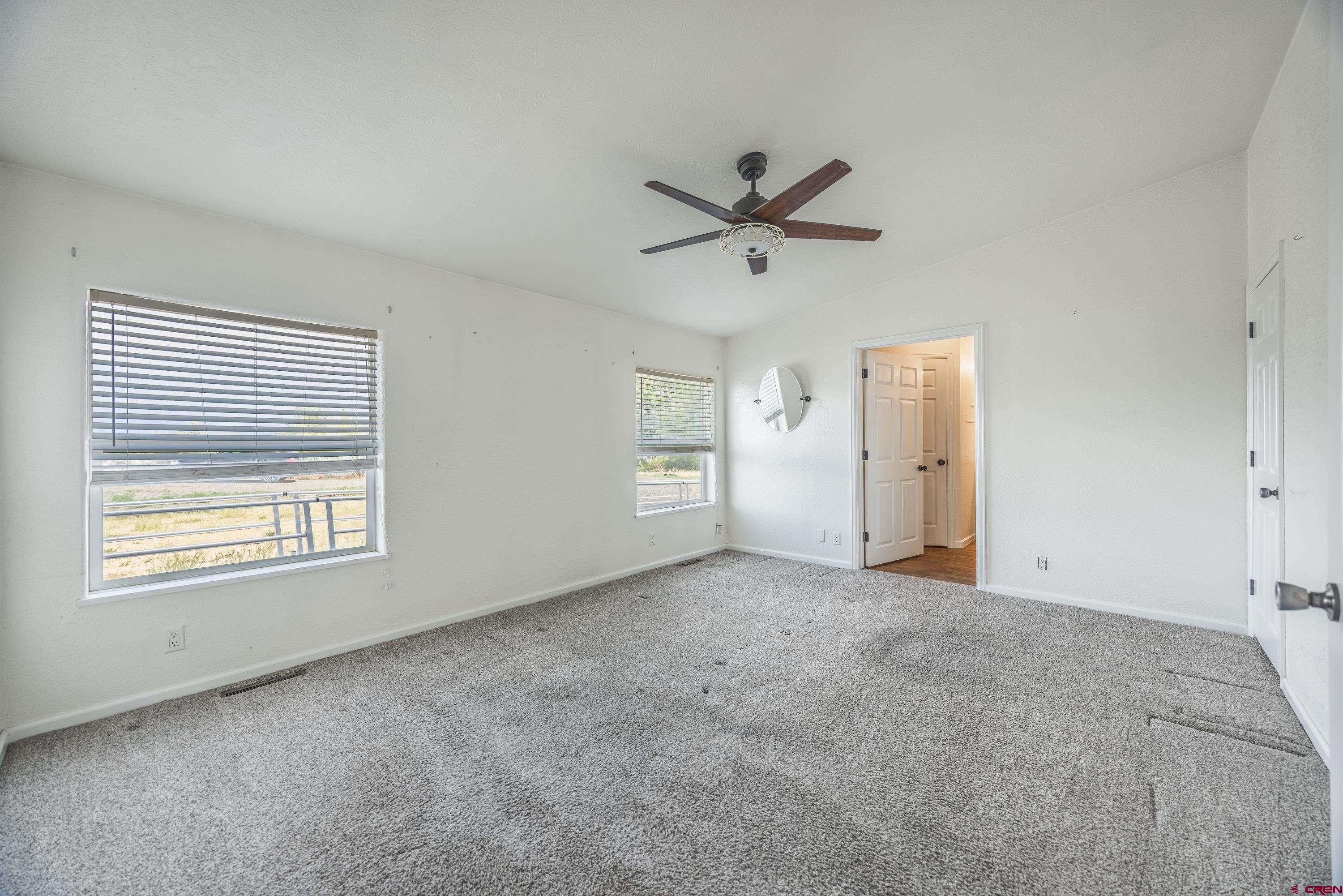 17377 Breeze Road Delta, CO 81416 - Photo 17 of 45 a view of an empty room with a window